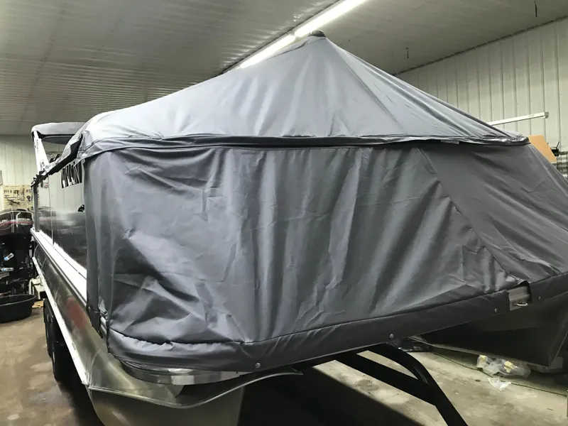 Slide: The Image of Covered Avalon GEOfish REAR FISH boat, 2025 model, in a storage facility. - 46