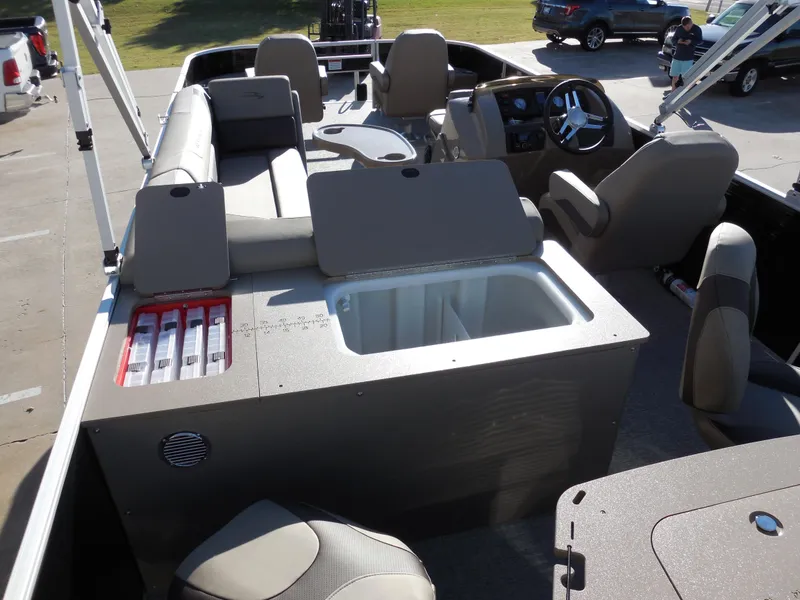 Slide: The Image of 2025 Bennington 22 SFX APG boat interior with seating and storage compartments. - 10