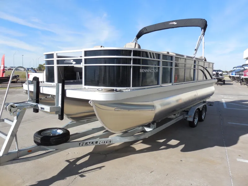 Slide: The Image of 2025 Bennington 22 SFX APG pontoon boat on trailer, sunny day. - 5