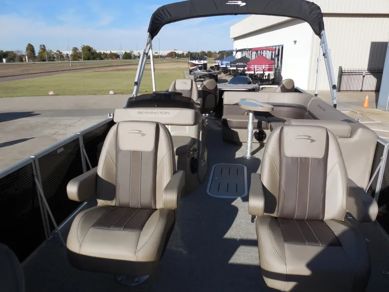Slide: The Image of 2025 Bennington 22 SFX APG pontoon boat interior with plush seating. - 6