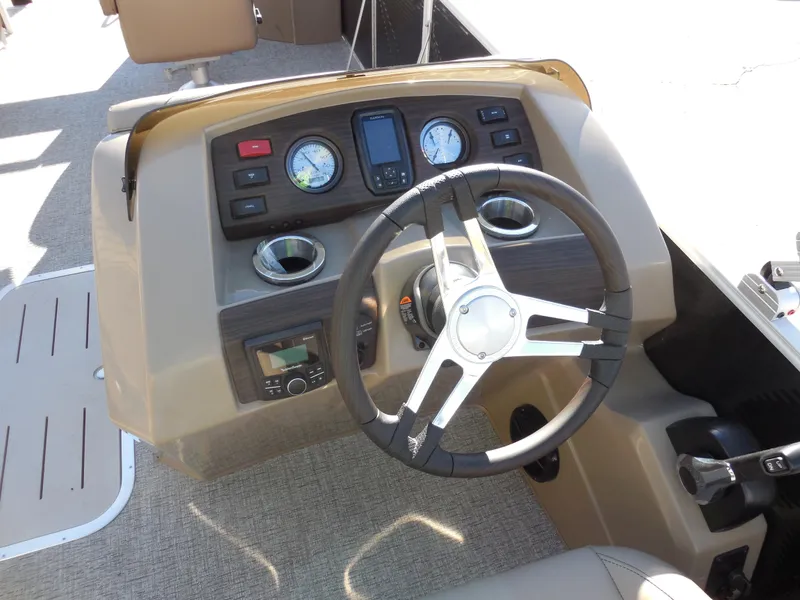 Slide: The Image of 2025 Bennington 22 SFX APG boat dashboard with steering wheel and instrument panel. - 8