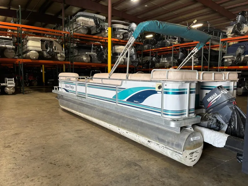 Slide: The Image of 1998 Godfrey AquaPatio 240 LE pontoon boat in storage facility. - 9