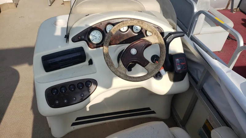 Slide: The Image of Steering console of a 2000 Bennington 2275 RL boat with gauges and controls. - 4