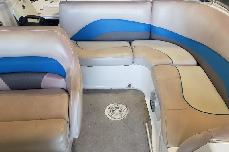 Slide: The Image of 2009 Hurricane FunDeck GS 202 I/O boat interior with beige and blue seating. - 4