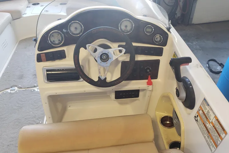 Slide: The Image of 2009 Hurricane FunDeck GS 202 I/O boat dashboard with steering wheel and controls. - 5