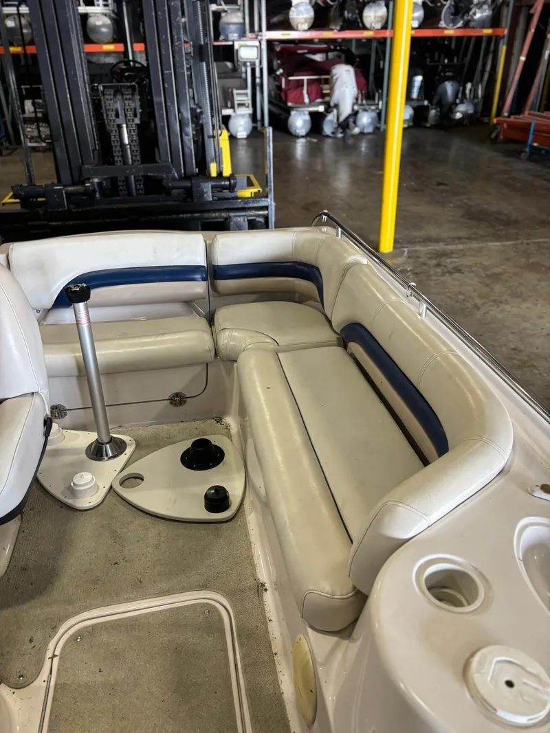 Slide: The Image of 2001 Hurricane FunDeck GS 201 I/O boat interior with seating and cup holders in storage facility. - 3