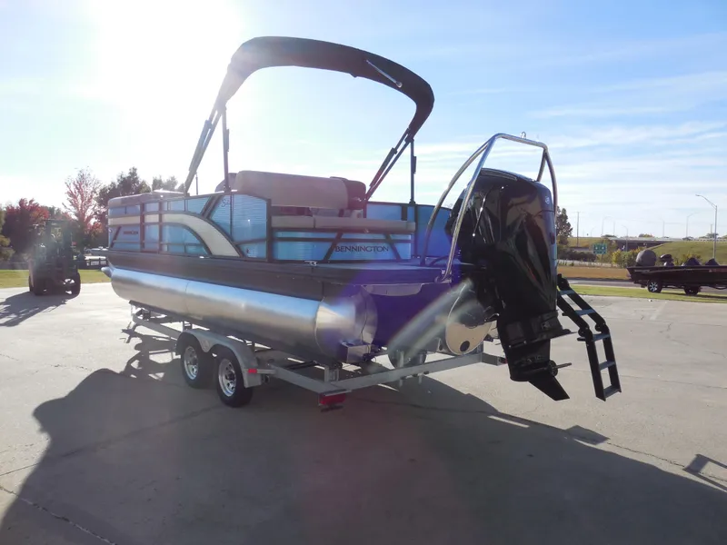 Slide: The Image of 2025 Bennington 22 SSB pontoon boat on trailer, sunny day, rear view. - 4