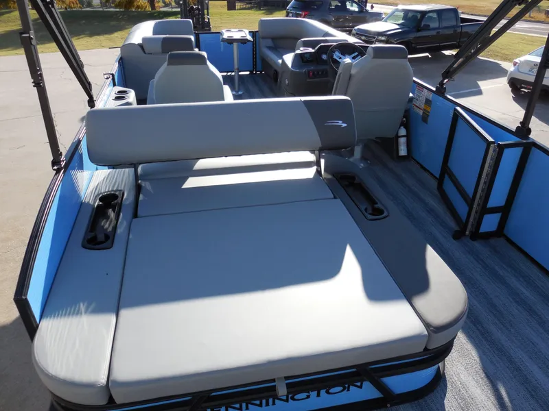 Slide: The Image of 2025 Bennington 22 SSB pontoon boat interior with seating and steering console. - 9