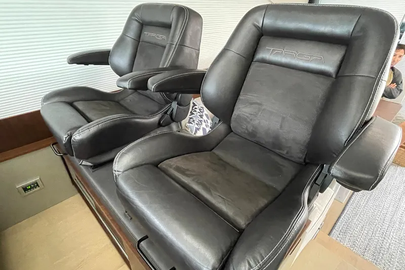 Slide: The Image of Luxurious black leather seats in a 2015 Fairline Targa 62 GT yacht interior. - 14