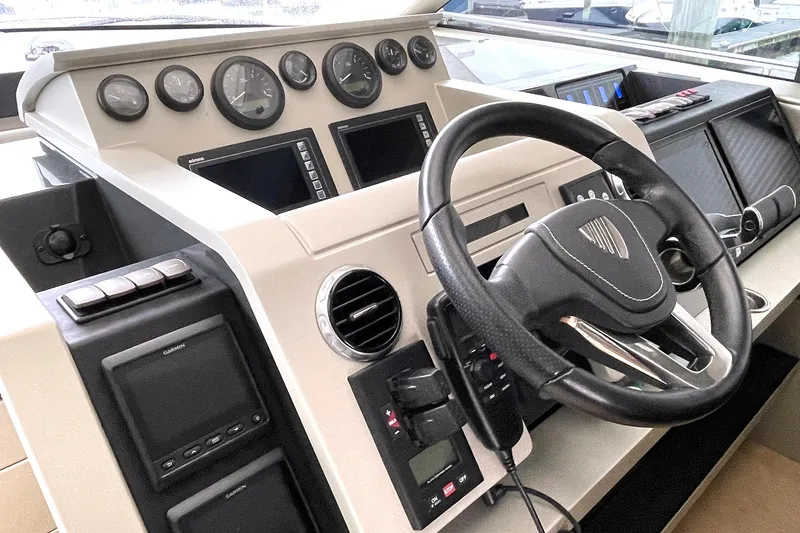 Slide: The Image of Fairline Targa 62 GT 2015 yacht helm with modern controls and steering wheel. - 15