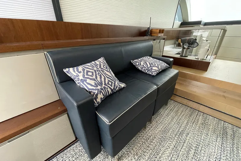 Slide: The Image of Luxurious interior of 2015 Fairline Targa 62 GT with stylish leather seating and patterned cushions. - 19