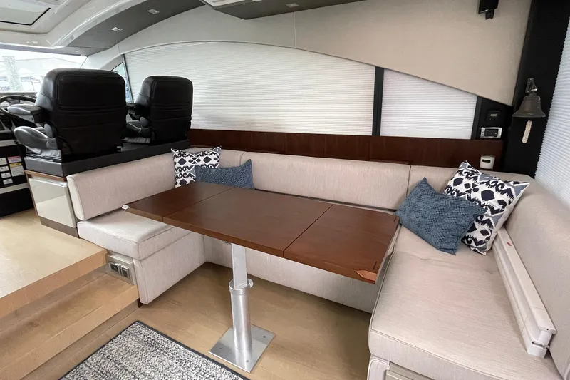 Slide: The Image of Luxurious interior of 2015 Fairline Targa 62 GT yacht with plush seating and wooden table. - 20