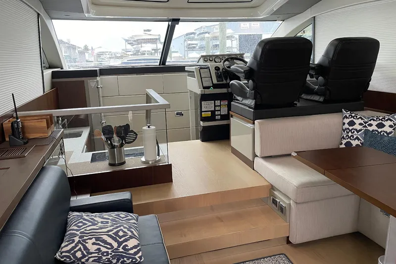 Slide: The Image of Luxurious interior of 2015 Fairline Targa 62 GT yacht with modern seating and helm. - 21