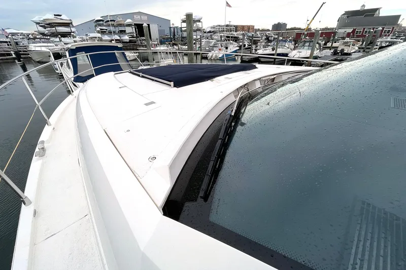 Slide: The Image of 2015 Fairline Targa 62 GT yacht at marina, showcasing sleek design and wet deck. - 3