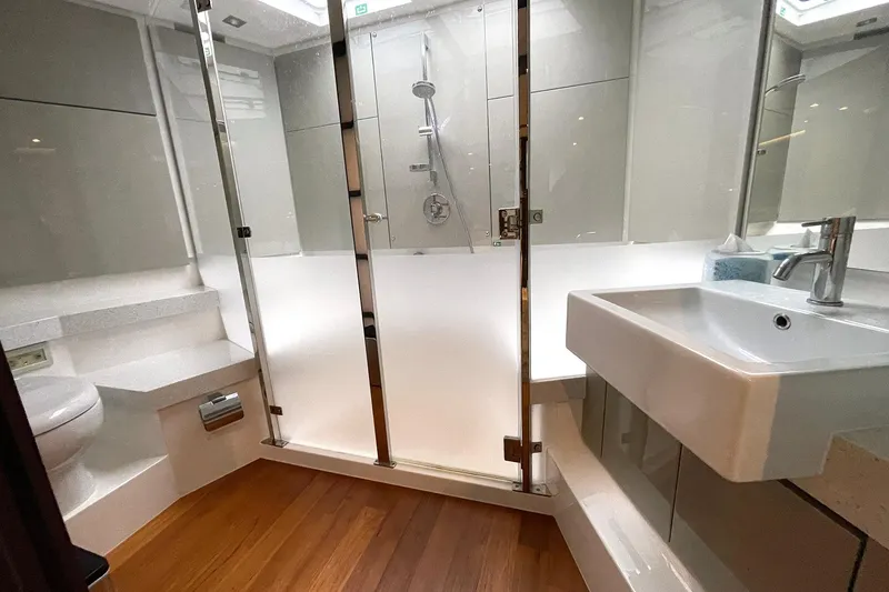 Slide: The Image of Luxurious bathroom in 2015 Fairline Targa 62 GT yacht with modern fixtures and wooden flooring. - 5