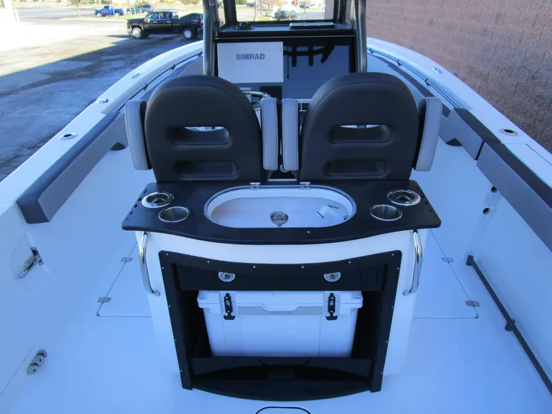 Slide: The Image of 2025 Sea Pro 292 Offshore boat interior with seating and storage. - 11
