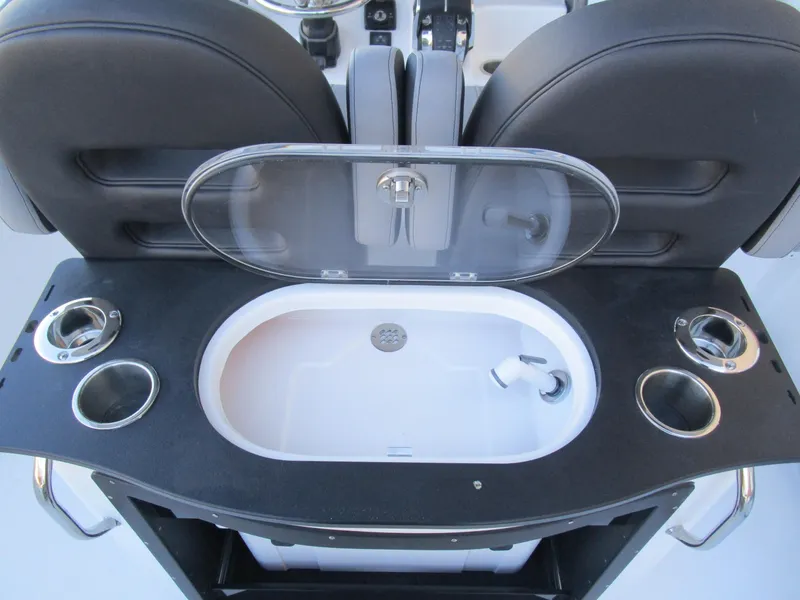 Slide: The Image of 2025 Sea Pro 292 Offshore boat interior with sink and cup holders. - 12