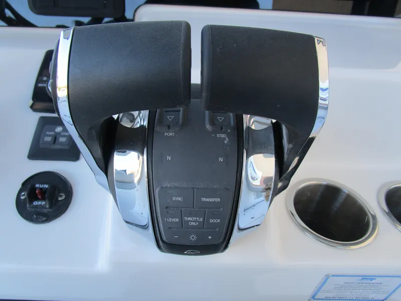 Slide: The Image of Dual throttle controls on 2025 Sea Pro 292 Offshore boat dashboard. - 20