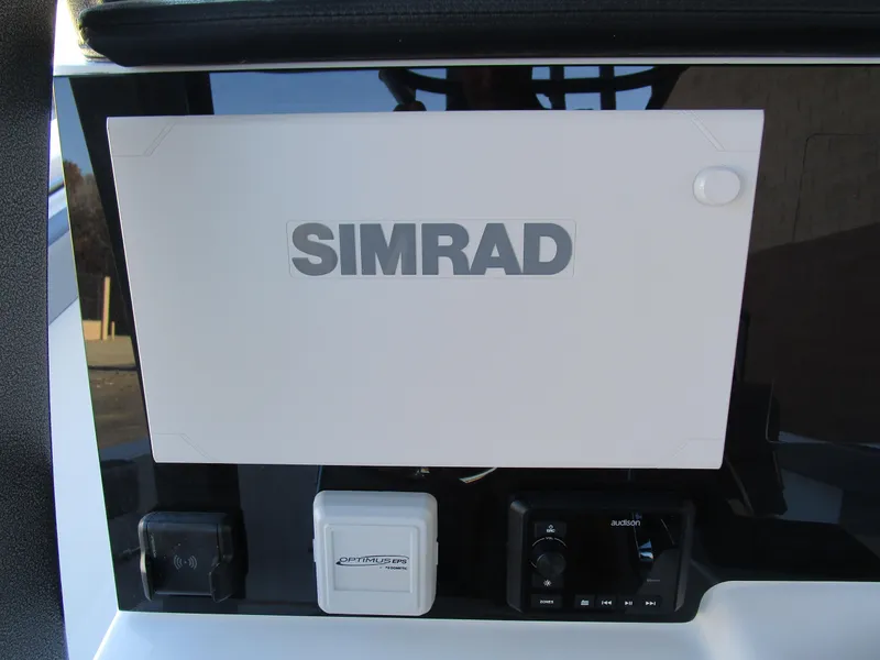 Slide: The Image of Simrad navigation system on 2025 Sea Pro 292 Offshore boat dashboard. - 22