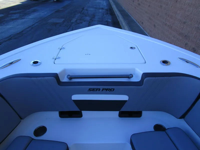 Slide: The Image of 2025 Sea Pro 292 Offshore boat interior, featuring sleek seating and storage compartments. - 30