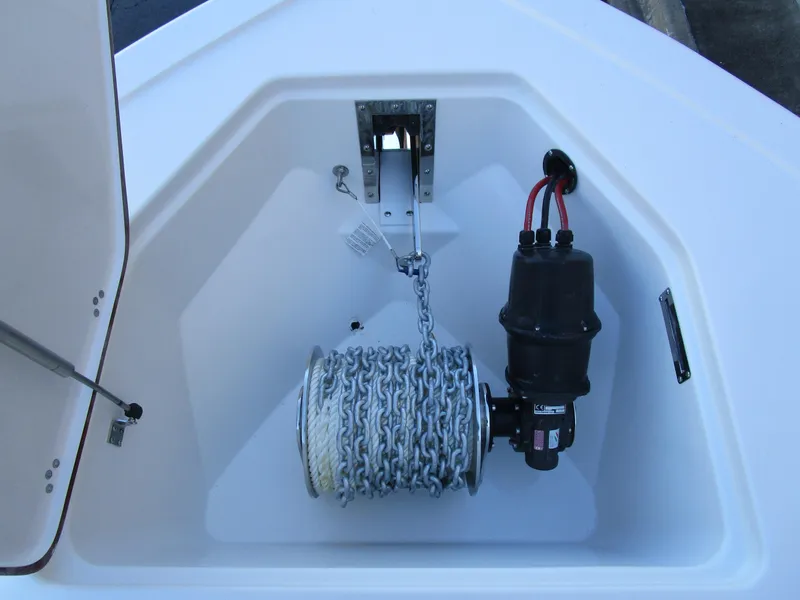 Slide: The Image of Anchor storage compartment of 2025 Sea Pro 292 Offshore boat with chain and winch. - 31