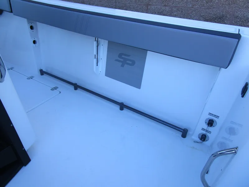 Slide: The Image of 2025 Sea Pro 292 Offshore boat interior with storage and control panel. - 35