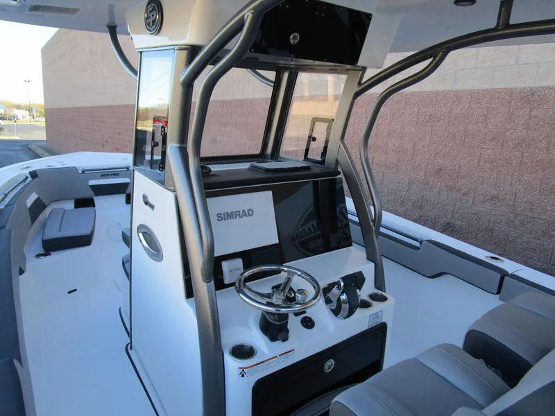 Slide: The Image of 2025 Sea Pro 292 Offshore boat interior with modern helm and seating. - 36