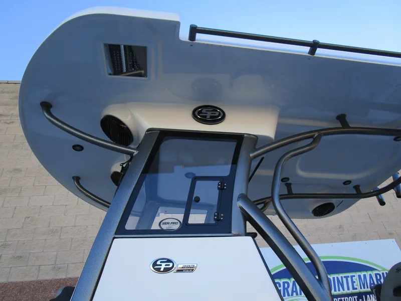 Slide: The Image of 2025 Sea Pro 292 Offshore boat, close-up of helm and T-top design. - 41