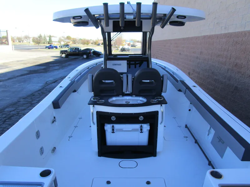 Slide: The Image of 2025 Sea Pro 292 Offshore boat interior with seating and console. - 5