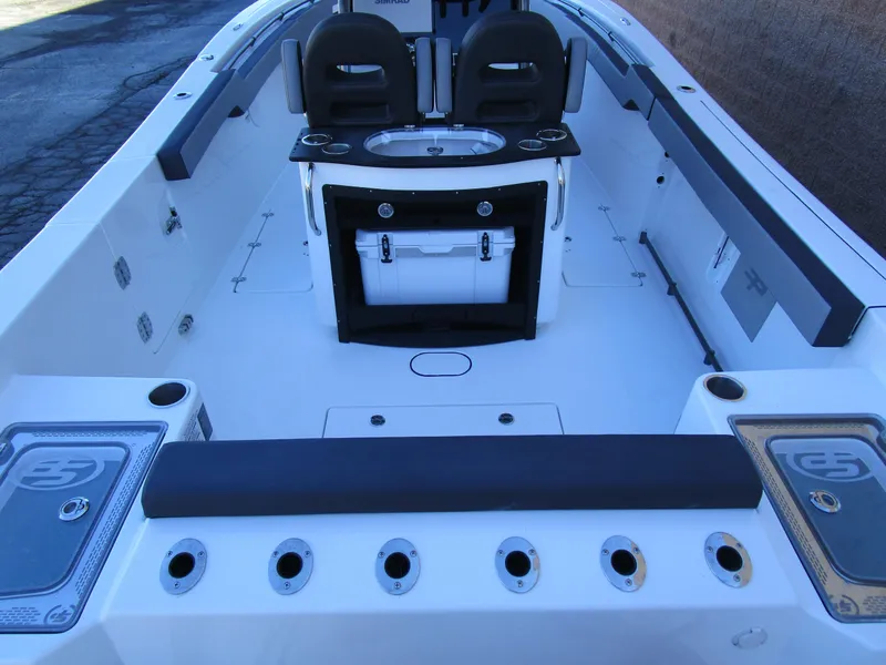 Slide: The Image of 2025 Sea Pro 292 Offshore boat interior with seating and storage compartments. - 6