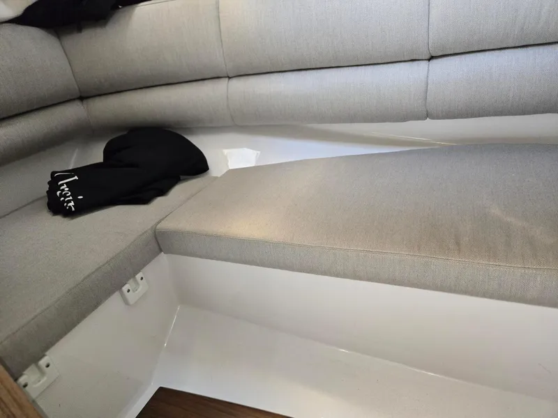 Slide: The Image of Interior seating of 2019 Four Winns H350 boat with gray upholstery. - 11