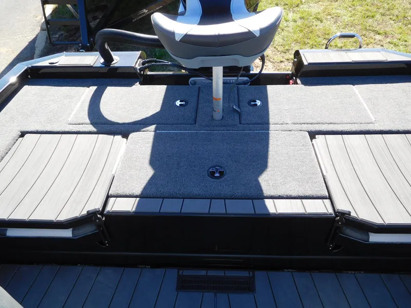 Slide: The Image of 2025 Vexus AVX 1985s boat deck with seating and storage compartments. - 12