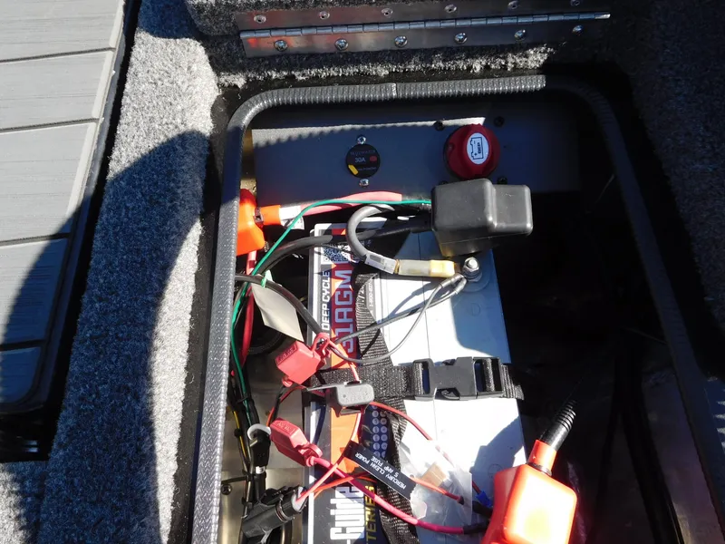 Slide: The Image of 2025 Vexus AVX 1985s boat battery compartment with wiring and connections. - 16