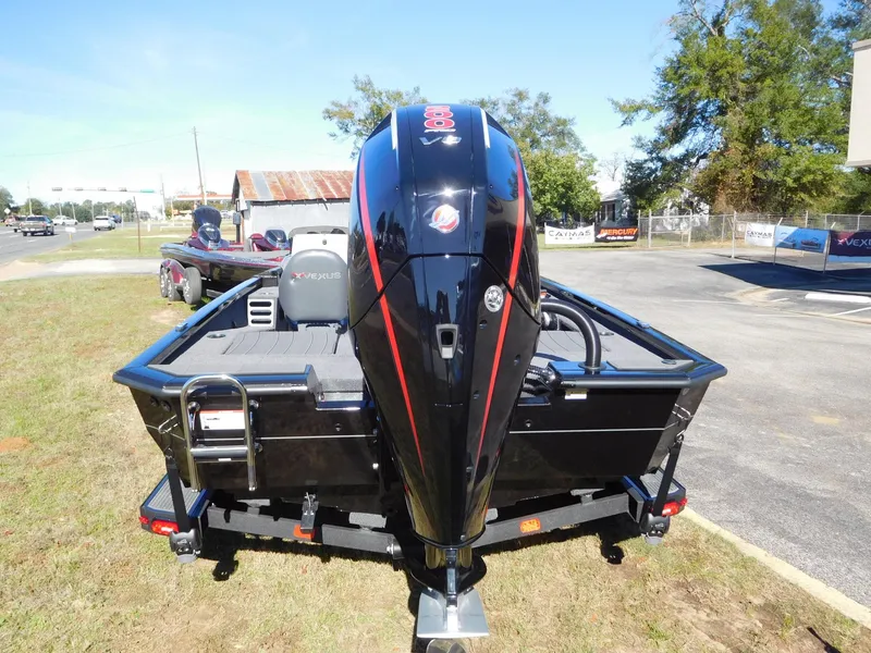 Slide: The Image of 2025 Vexus AVX 1985s boat with powerful outboard motor, parked outdoors. - 17