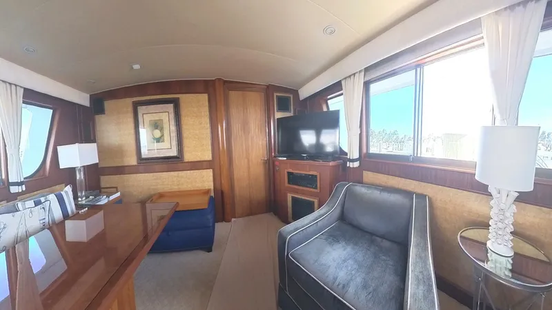 Slide: The Image of Luxurious interior of 1982 Hatteras 65 LRC yacht with elegant furnishings. - 14