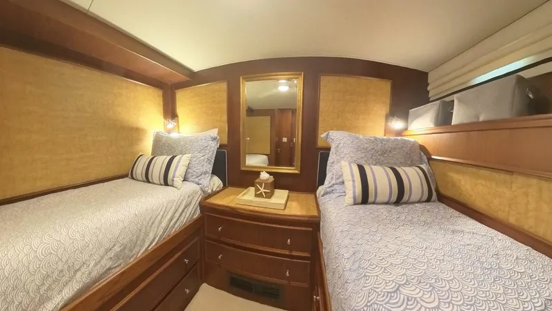 Slide: The Image of Cozy twin cabin in 1982 Hatteras 65 LRC yacht with elegant decor. - 24