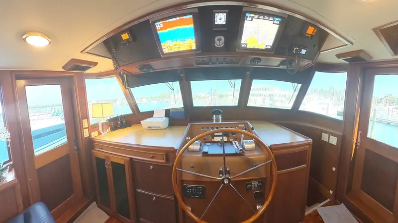 Slide: The Image of Interior helm of 1982 Hatteras 65 LRC yacht with navigation equipment. - 9