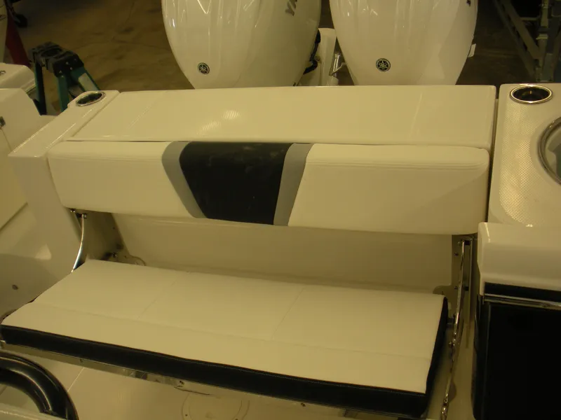 Slide: The Image of 2025 Robalo R250 Center Console boat seating area with dual engines. - 21