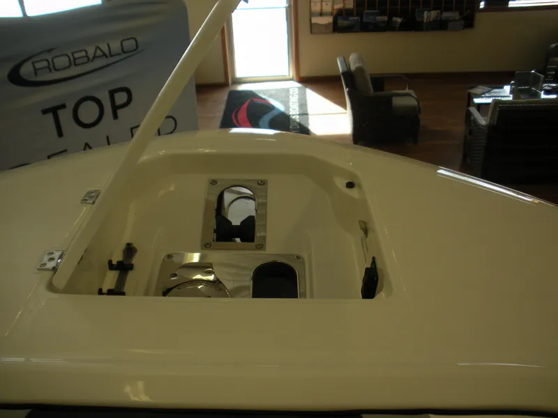 Slide: The Image of 2025 Robalo R250 Center Console boat interior with open hatch. - 6