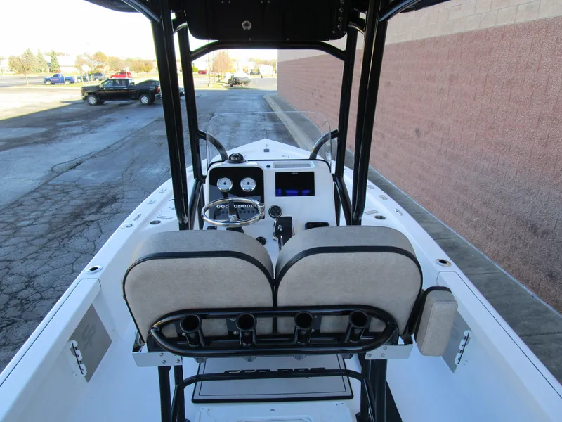 Slide: The Image of 2025 Sea Pro 230 Bay boat interior with dual seats and control panel. - 12