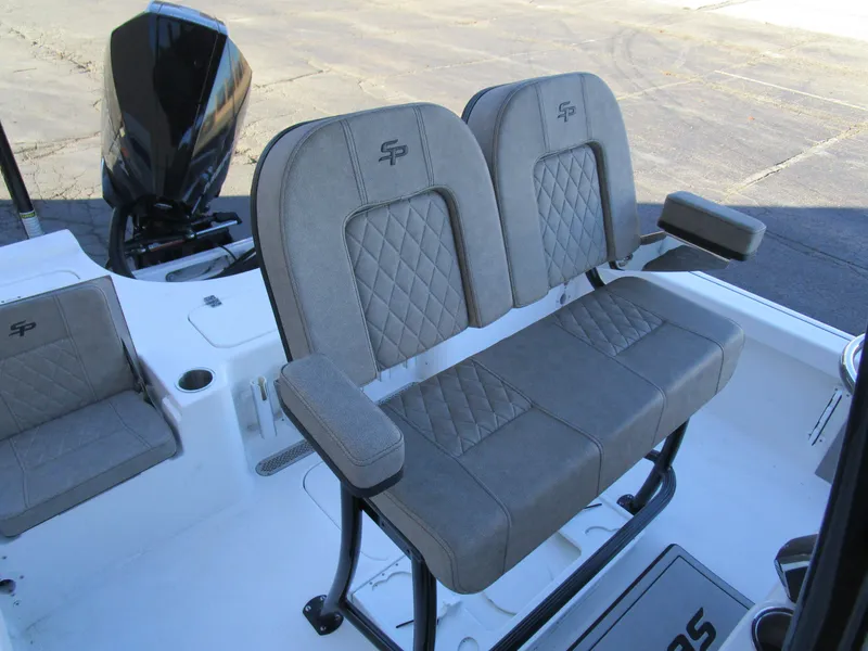 Slide: The Image of 2025 Sea Pro 230 Bay boat seating with diamond-stitched upholstery and armrests. - 14
