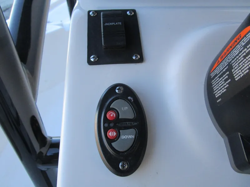 Slide: The Image of Control panel of 2025 Sea Pro 230 Bay boat with jackplate switch. - 18
