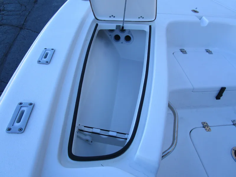 Slide: The Image of Open storage compartment on 2025 Sea Pro 230 Bay boat deck. - 21