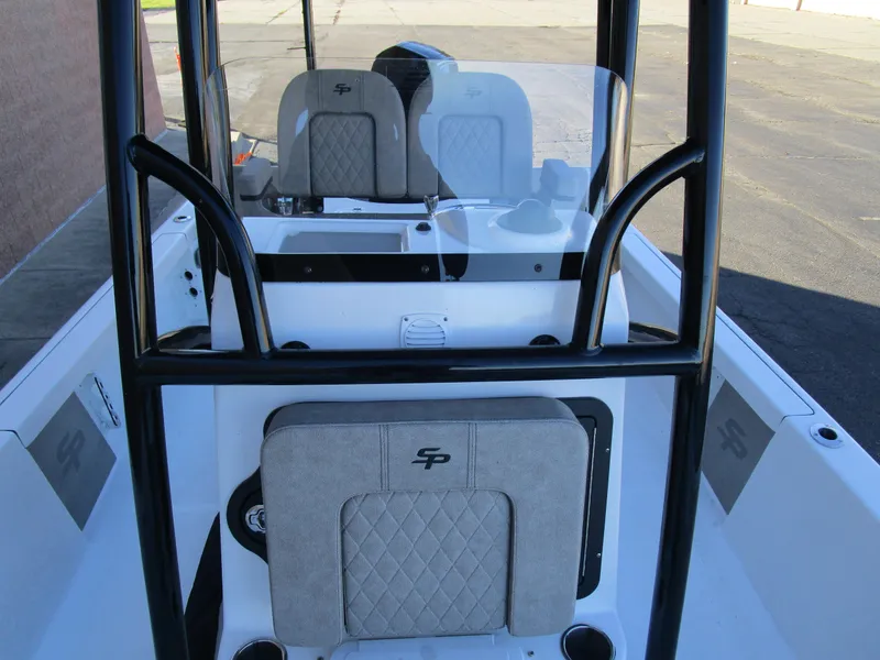 Slide: The Image of 2025 Sea Pro 230 Bay boat interior with cushioned seating and sleek design. - 23