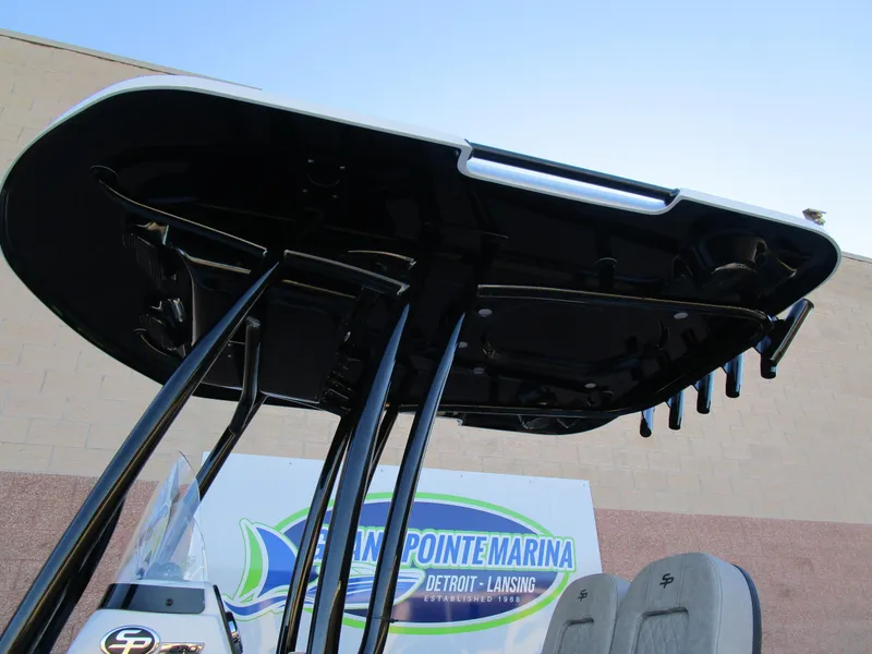 Slide: The Image of 2025 Sea Pro 230 Bay boat T-top at marina, showcasing sleek design and sturdy construction. - 25