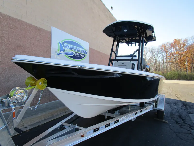 Slide: The Image of 2025 Sea Pro 230 Bay boat on trailer, displayed outdoors. - 3