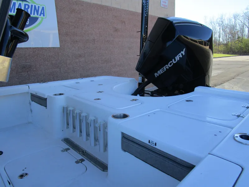 Slide: The Image of 2025 Sea Pro 230 Bay boat with Mercury engine, docked outdoors. - 7