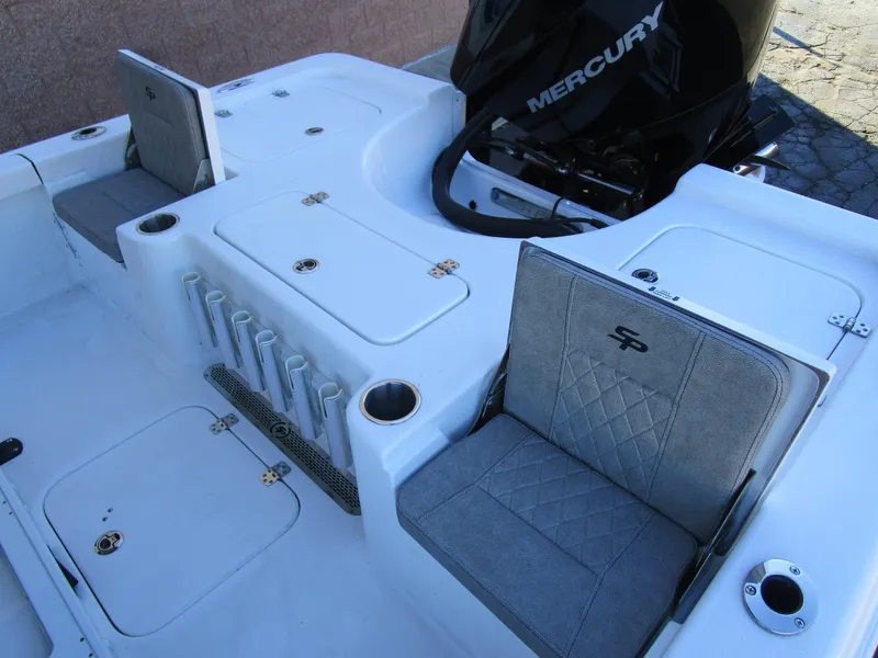 Slide: The Image of 2025 Sea Pro 230 Bay boat interior with Mercury engine and seating. - 8