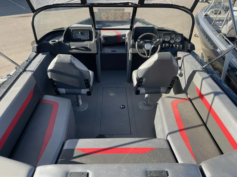 Slide: The Image of 2024 Princecraft Sport 175 MAX boat interior with modern seating and dashboard. - 10