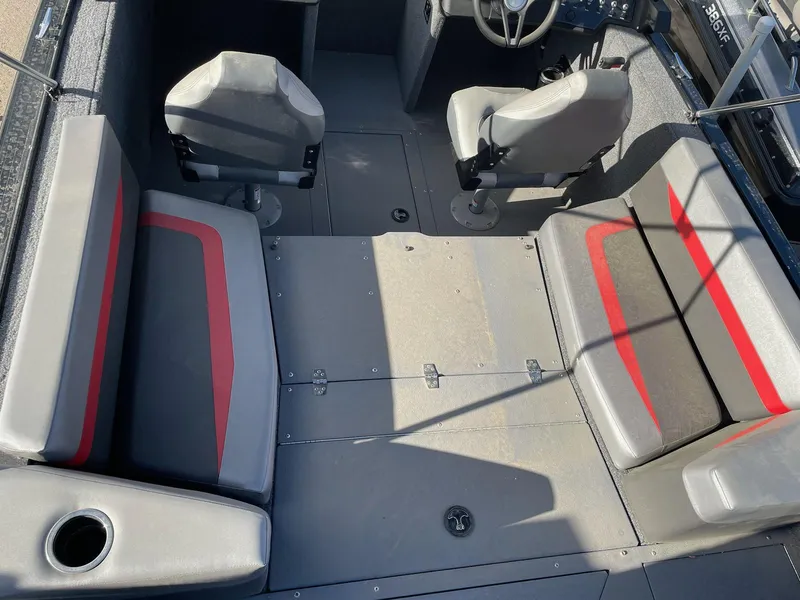 Slide: The Image of 2024 Princecraft Sport 175 MAX interior with gray and red seating. - 11